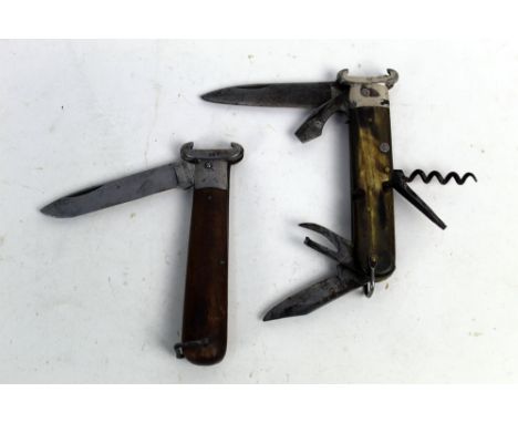 A Teja and Rosa folding knife with combined 16 bore and 12 bore shotgun cartridge extractor, together with another multi tool