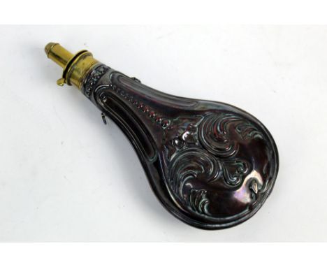 A large powder flask with copper body and brass head, stamped Patent, the overall length 25 cm, width +/- 11.5 cm.