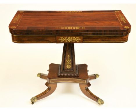 An attractive Regency period fold-over rosewood and brass inlaid Card Table, on upward square tapering stem with bead collar 