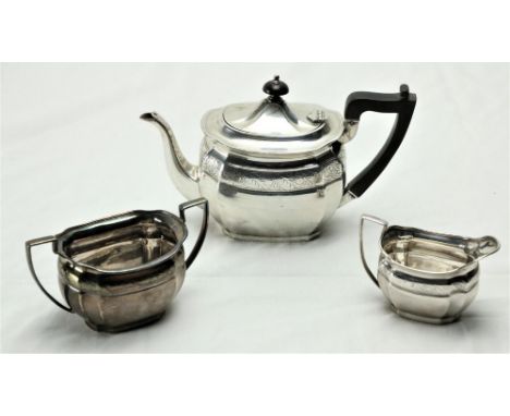 A three piece silver bright cut Bachelors Tea Service, Sheffield 1900 / 1902, comprising oval teapot, two handled sugar bowl 