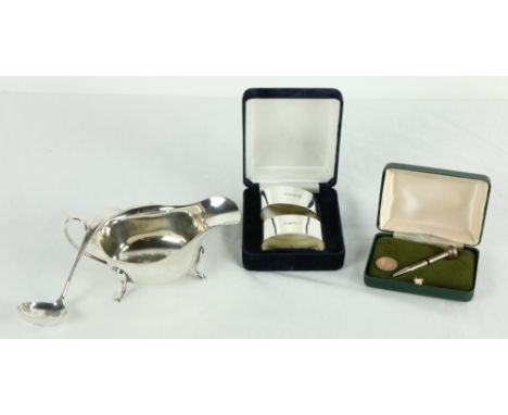 A Sheffield silver Sauceboat, c. 1890, 111 grams; a Sheffield silver Sauce Ladle, 31 grams; a pair of modern cased silver ova