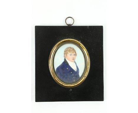 Attributed to Frederick Buck (1771 - 1839)A miniature Portrait, oval, "Gentleman wearing a navy jacket with white shirt and w