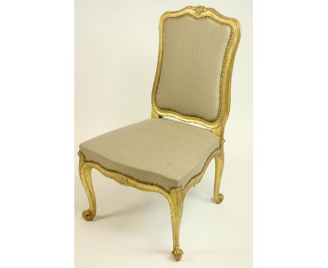 A very important gilt Side Chair, by John Trotter, with cartouche shaped back around a padded panel with brass studs above a 