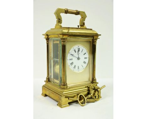 A good heavy French brass five glass Repeater Carriage Clock, with four half raised pilasters and a circular enamel dial with
