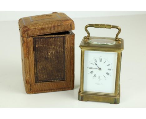A good brass Carriage Clock, by Hamann &amp; Koch, New York, with Roman numeral dial, with original key and leather bound car