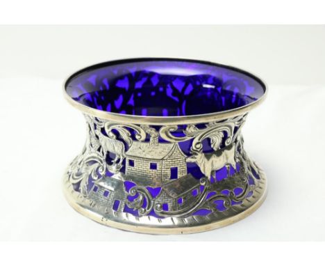 A good Irish silver Dish Ring, by West &amp; Son, Dublin 1916, chased and pierced, and with etched decoration of thatched cot
