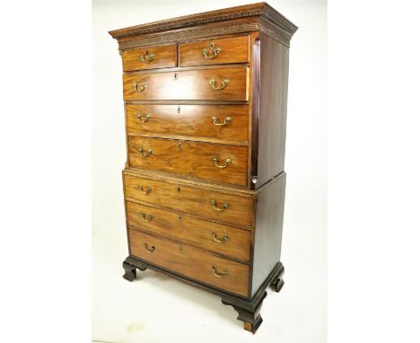 A George III period mahogany Chest on Chest, the Greek key moulded cornice above a blind fret frieze over three long and two 