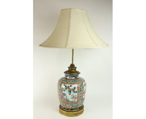 An attractive 19th Century Famille Verte ormolu mounted porcelain Jar, converted to Lamp, with cream coloured shade. (1) 