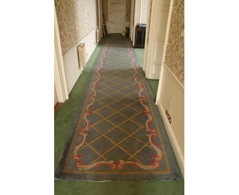 A fine large blue ground Connemara Runner, (McMurray Carpets),&nbsp;the centre gold trellis pattern through out, with attract