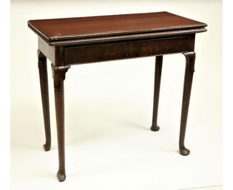 An 18th Century Irish mahogany fold-over Card Table, with rectangular top and plain frieze drawer on four lappet headed taper