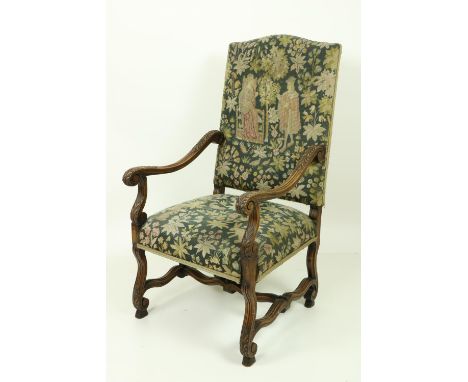 A 17th Century style carved and moulded walnut Armchair, with shaped stretchers, upholstered with tapestry back and seat. (1)