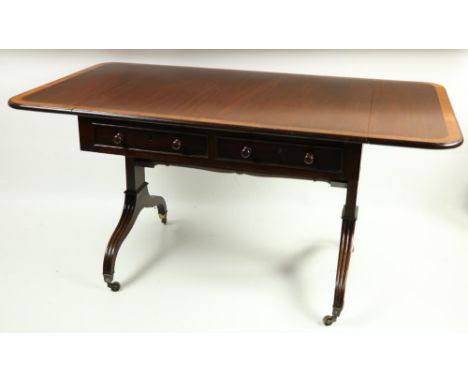 A desirable Georgian period mahogany Sofa Table, the rectangular top with large border of satinwood crossbanding, incorporati