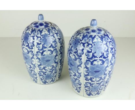 A pair of Chinese blue and white porcelain Vases and Covers (one as is), 15" (38cms); together with a small Architectural sla