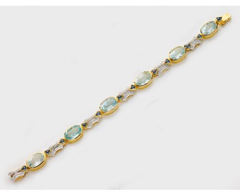 Elegantes Blautopas-Diamantarmband Gelbgold, gest. 750. Schauseitig besetzt mit 6 Blautopasen von zus. ca. 24,80 ct. im Ovals