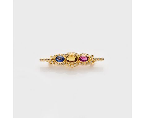 Saphir-Rubin-Brosche mit Diamantbesatz Gelbgold, gest. 585. Besetzt mit einem gelben Saphir von ca. 0,98 ct., flankiert von e