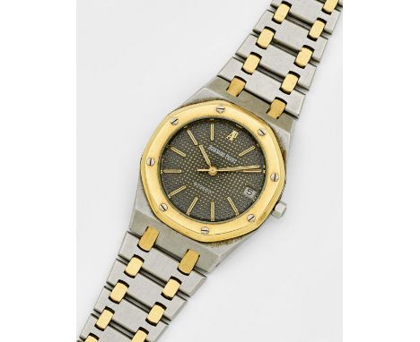 Herrenarmbanduhr von Audemars Piguet-"Royal Oak" Stahl und 18 ct. Gelbgold. Oktogonales Uhrengehäuse, Zifferblatt mit schwarz