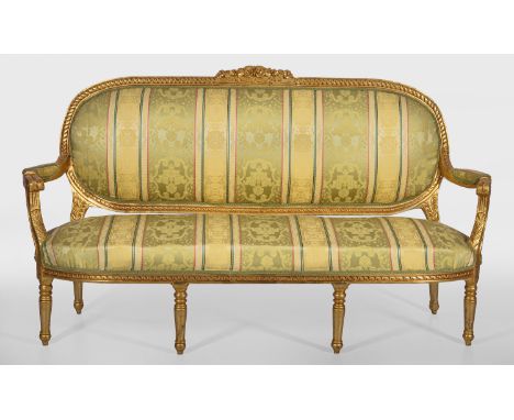 Salongarnitur im Louis XVI-Stil 5-tlg.; Canapé und vier Armlehnsessel. Holz, reliefiert und vergoldet. Bombierte Profilzarge 