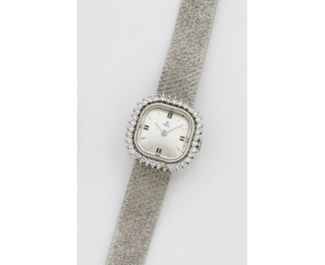 Schmuck-Damenarmbanduhr von EBEL aus den 1960er Jahren Weißgold, gest. 750. Nahezu quadratisches Uhrengehäuse, Lünette mit Br
