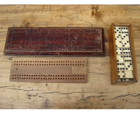 Two cribbage boards and a good boxed set of dominoes together with shells, cards and card games including Jaques "The Great G