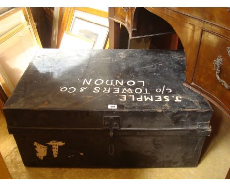 A black painted metal trunk. 