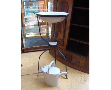 An enamel washstand with enamel water can (2). 