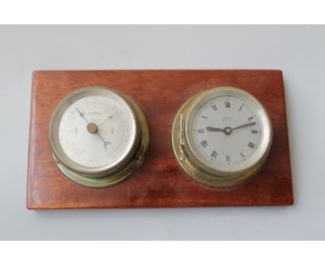 A VINTAGE SHIP'S CLOCK STYLE CLOCK AND BAROMETER, mounted on a board, signed 'Maspro', dial diameter 7 cm Buyers - for shippi