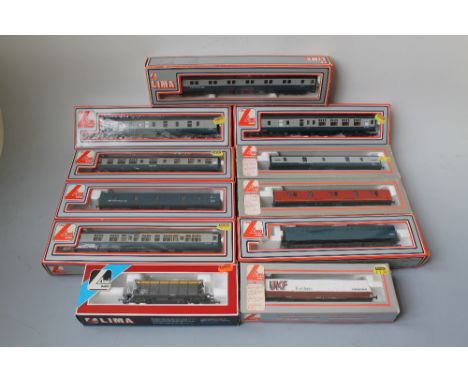A TRAY OF LIMA 00 GAUGE ROLLING STOCK, consisting of hopper wagons and carriages, mostly BR blue/grey MKI Buyers - for shippi