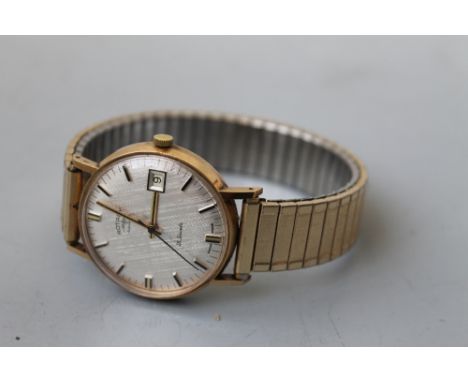 A GENTLEMAN'S 9 CT GOLD CASED 'ROTARY AUTOMATIC' WRISTWATCH, textured champagne dial, with baton markers Buyers - for shippin