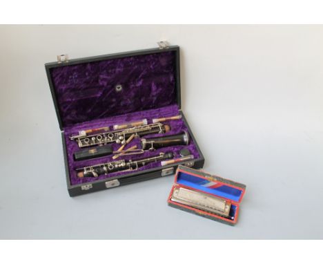 A CASED WOODEN 'LOUIS' LMS OBOE, marked as made for 'Rudall, Carte & Co Ltd' and a case d 'Hohner, Super Chromonica' Harmonic