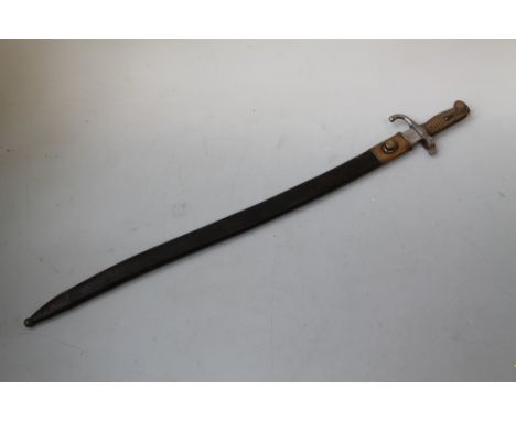 A 19TH CENTURY FRENCH CHASSEPOT TYPE BAYONET, brass ribbed grip, steel fittings, in leather scabbard, L 77 cm  Buyers - for s