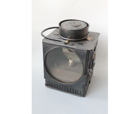 A BLACK PAINTED RAILWAY SIGNAL LAMP, complete with burner, marked '9237 MRSD 7' with swing carry handle, H 28 cm Buyers - for