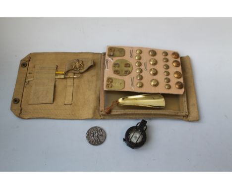 A GROUP OF MILITARY COLLECTABLES, to include a 1942 dated MKIII marching compass, 1944 canvas map case, a Lusitania iron meda