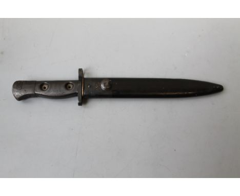 A BRITISH L1A3 BAYONET, black finished steel, with brass topped scabbard, L 31.5 cm Buyers - for shipping pricing on this lot