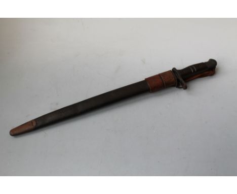 A WWI '1917 US REMINGTON' BAYONET, with scabbard and later frog marked 'B. H. & C. 1940', L 58 cm Buyers - for shipping prici