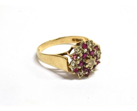 A VINTAGE 9CT GOLD, RUBY AND DIAMOND CLUSTER RING Illusion set at the centre with a small eight-cut diamond within a small ru