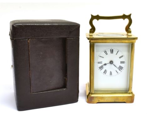 A BRASS CASED CARRIAGE CLOCK  the enamel dial with Roman numerals, 11.5cm high, together with carrying case