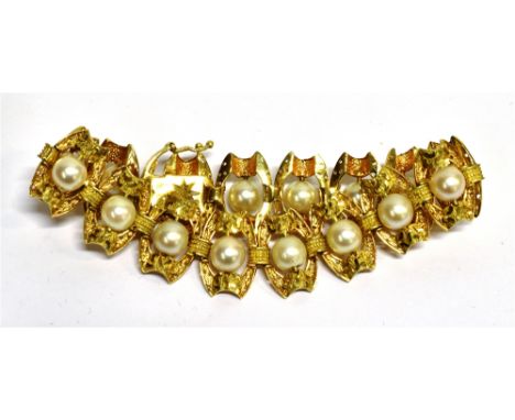 A VINTAGE CONTINENTAL YELLOW METAL AND CULTURED-PEARL BRACELET in the form of 15 fancy openwork barrel-shaped links each cent