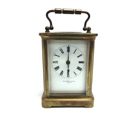 A BRASS CASED CARRIAGE CLOCK  with enamel dial inscribed 'MAPPIN &amp; WEBB LONDON'