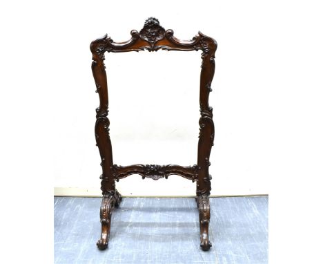 A CARVED ROSEWOOD TAPESTRY FRAME  the aperture 55cm x 70cm
