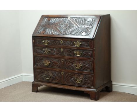 Early Georgian heavily carved oak bureau, fall front with fitted interior, four graduating drawers below, bracket feet, visib