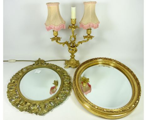 Gilded metal candelabra style table lamp, a gilt metal bevelled edge mirror and another oval bevelled edge mirror   Condition