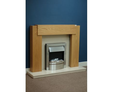 Contemporary fireplace comprising of - oak surround with granite hearth and inset with fuel effect electric fire, W138cm (hea
