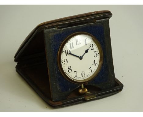 Three early 20th century travelling clocks and another travelling clock with thermometer CLOCKS & BAROMETERS - as we are not 