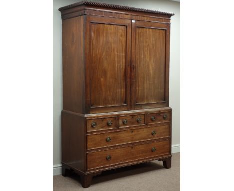 George III mahogany linen press, two panelled doors enclosing linen slide, three short and two long drawers below, rope twist