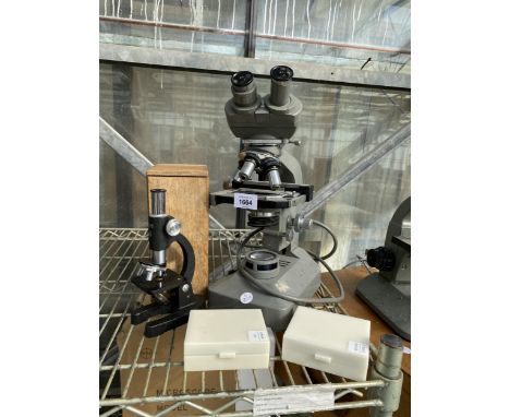 AN OLYMPUS MICROSCOPE AND A SMALL STEIN MICROSCOPE TOGETHER WITH TWO BOXES OF GLASS SLIDES