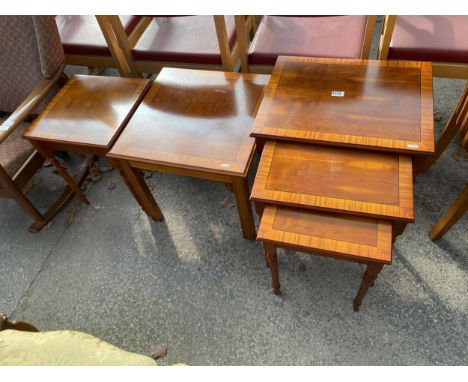 A YEW WOOD NEST OF THREE TABLES AND TWO LAMP TABLES