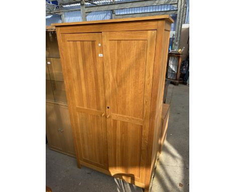 AN OAK CORDELL FURNITURE TWO DOOR WARDROBE, 42" WIDE