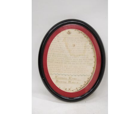 A VINTAGE NEEDLEWORK SAMPLER WORKED BY ELIZABETH EVANS, BODWENNI, AGED 10, IN AN OVAL FRAME, 32CM X 26CM