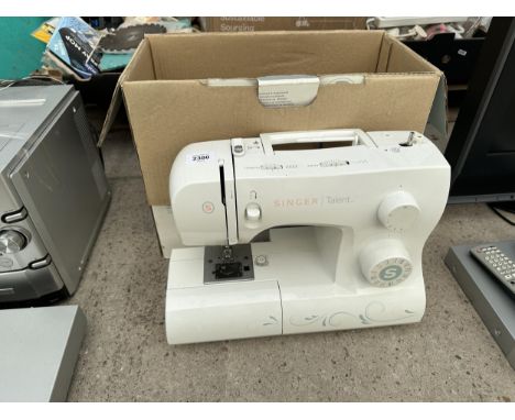 A SINGER TALENT ELECTRIC SEWING MACHINE