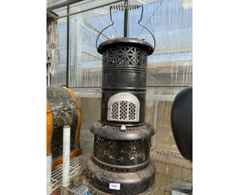 A VINTAGE AND DECORATIVE PARAFIN HEATER